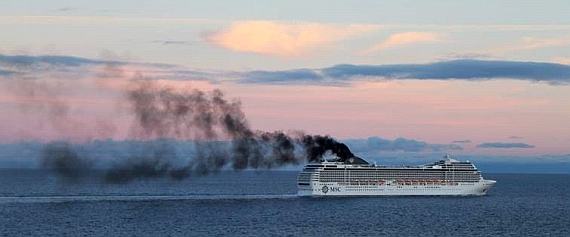 Dense, black smoke from white chimneys