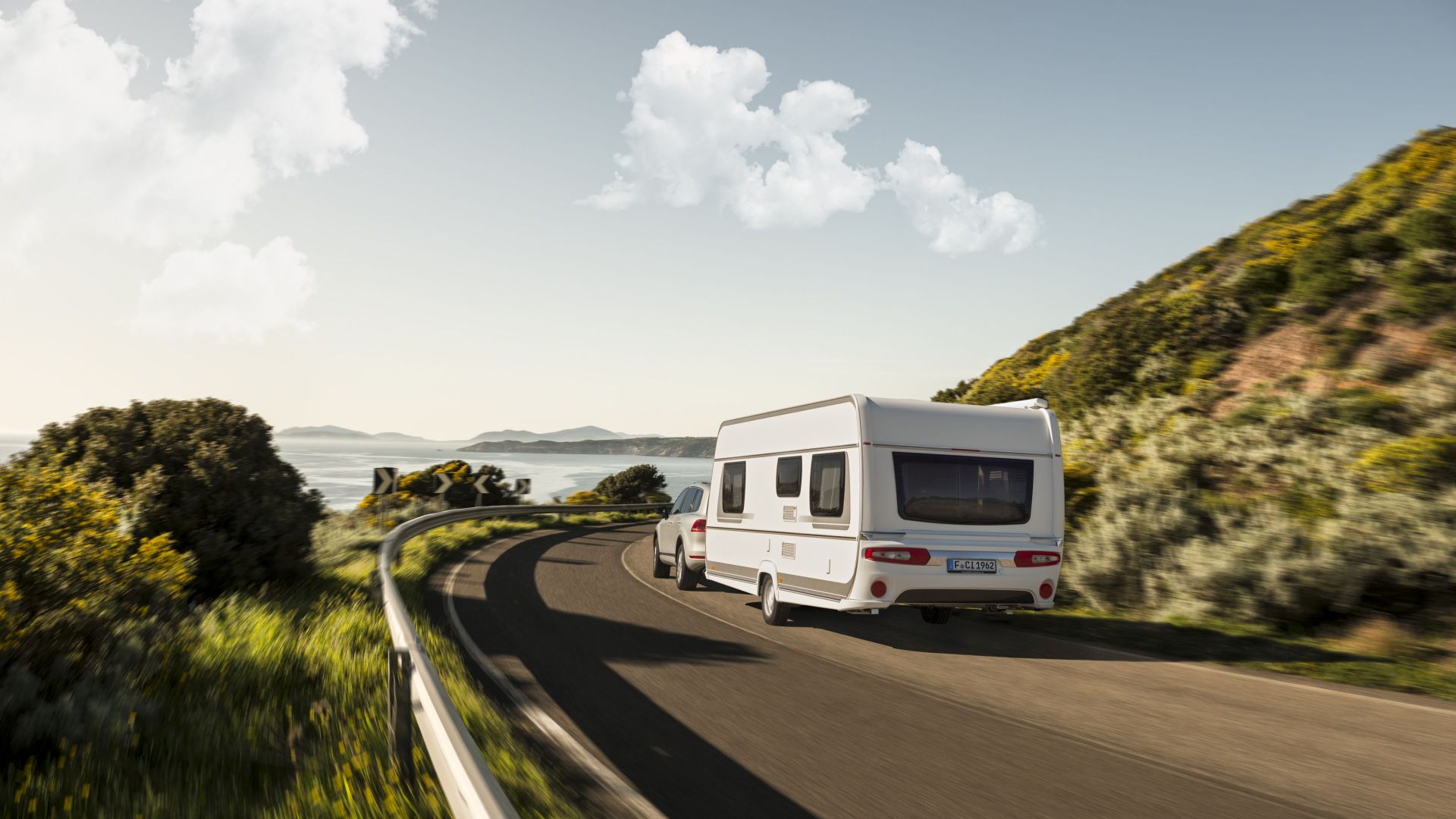 Caravan driving along a coast