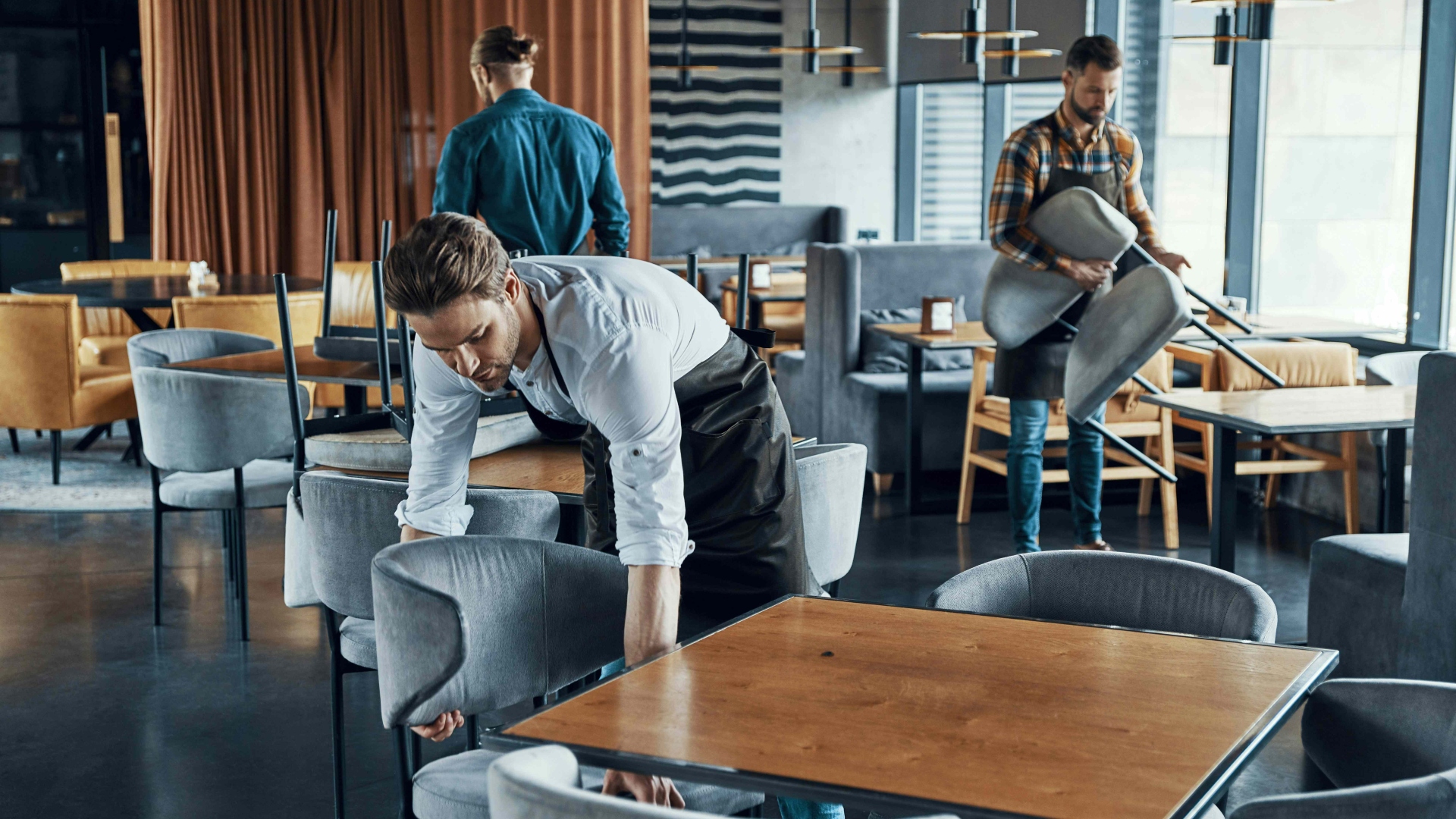 Young men working in restaurant